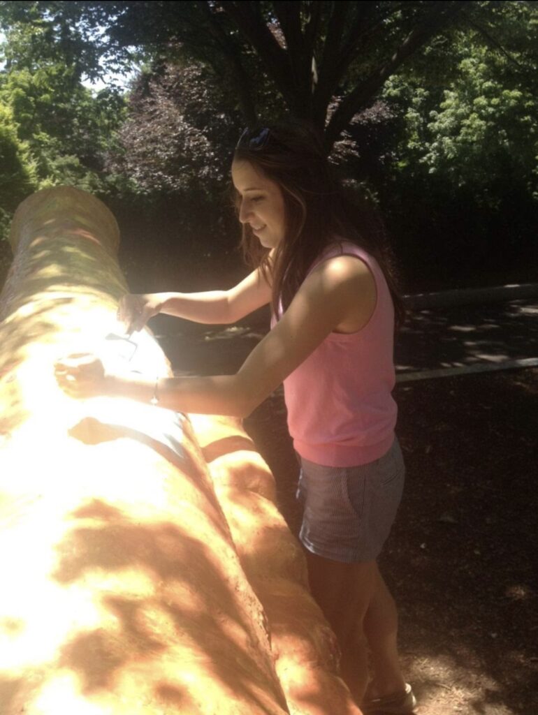 CCA's Melissa Fiorenza participating in the "Painting the Cannon" tradition at Tufts University.